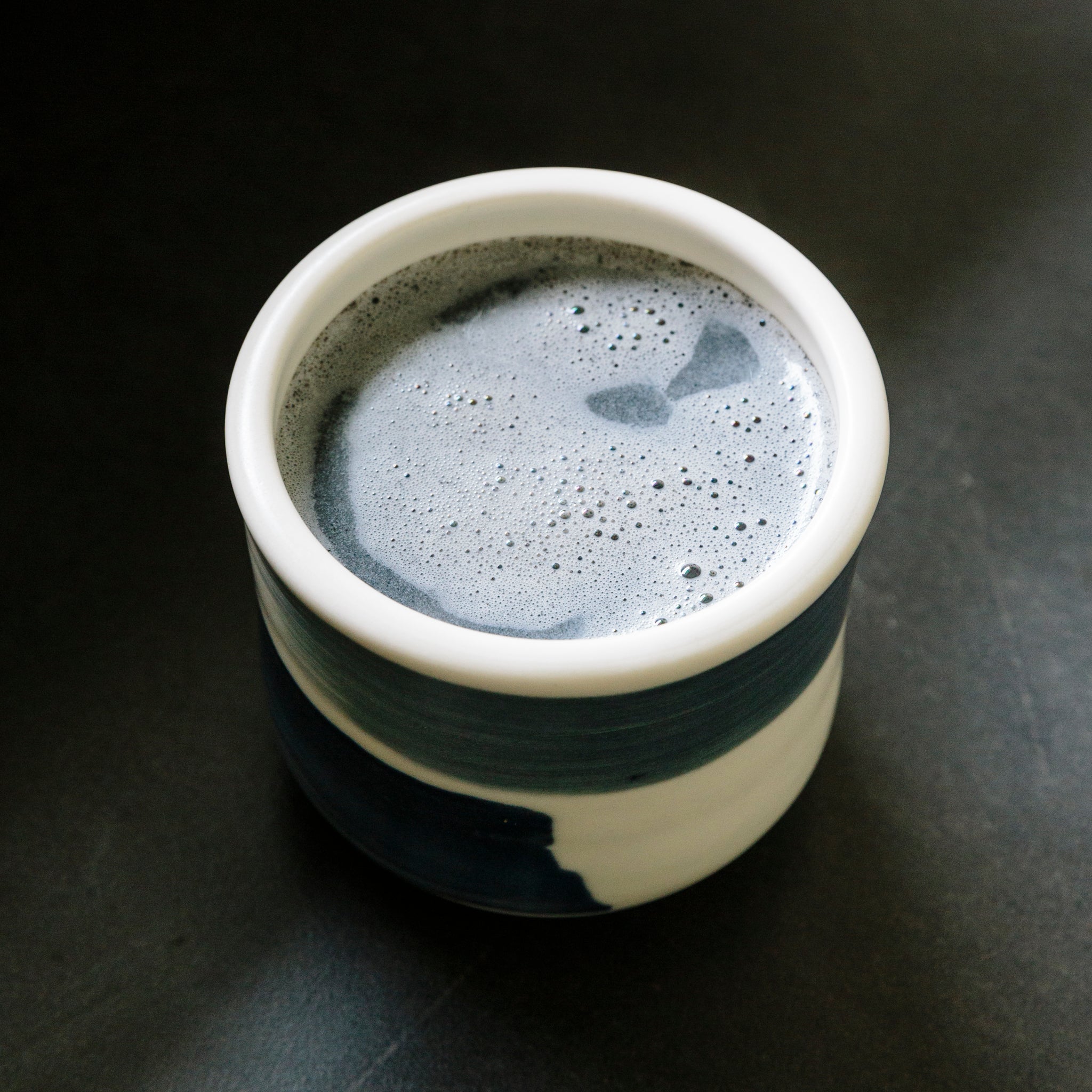 A mug of black sesame latte