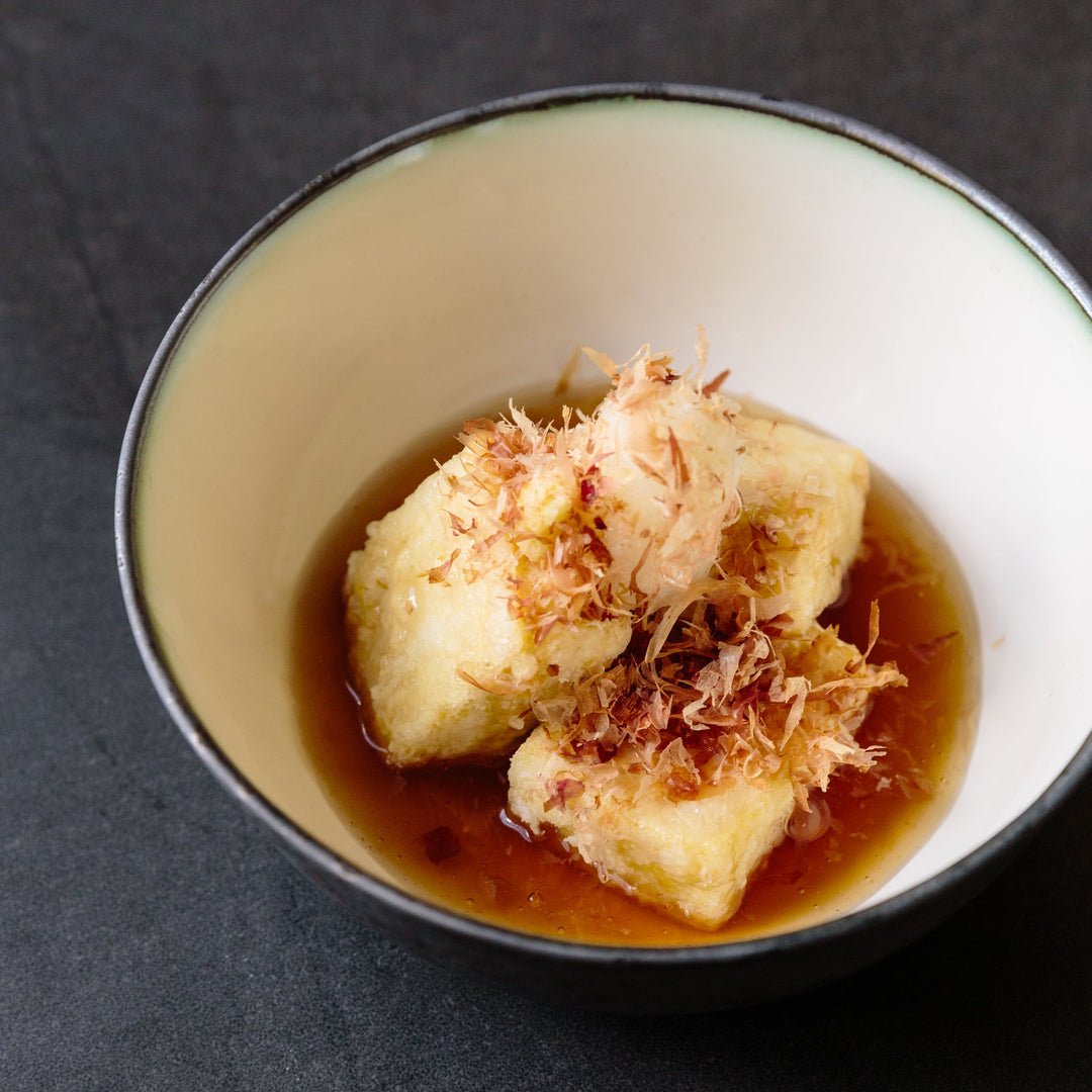 Agedashi tofu — lightly battered deep-fried tofu in a delicate Japanese dashi broth