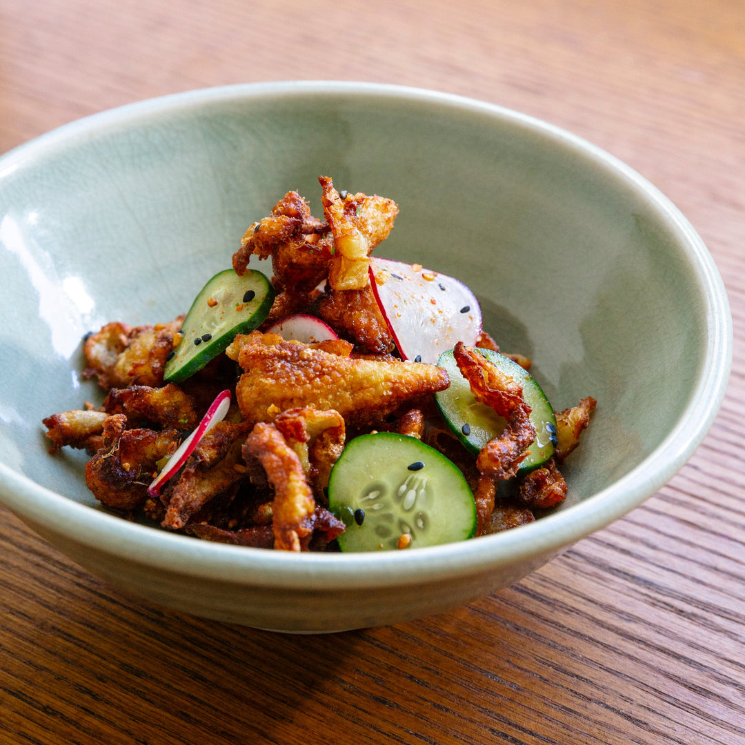 Crispy chicken skin salad with spicy ponzu and shichimi togarashi