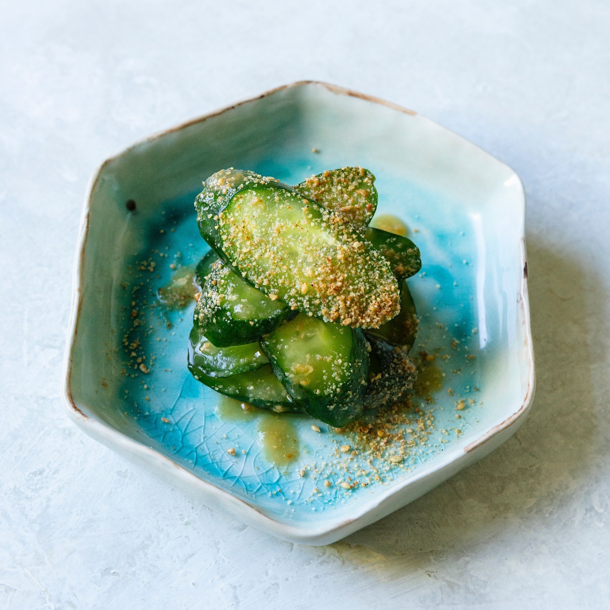 Japanese cucumber slices with ume miso dressing and sesame seeds
