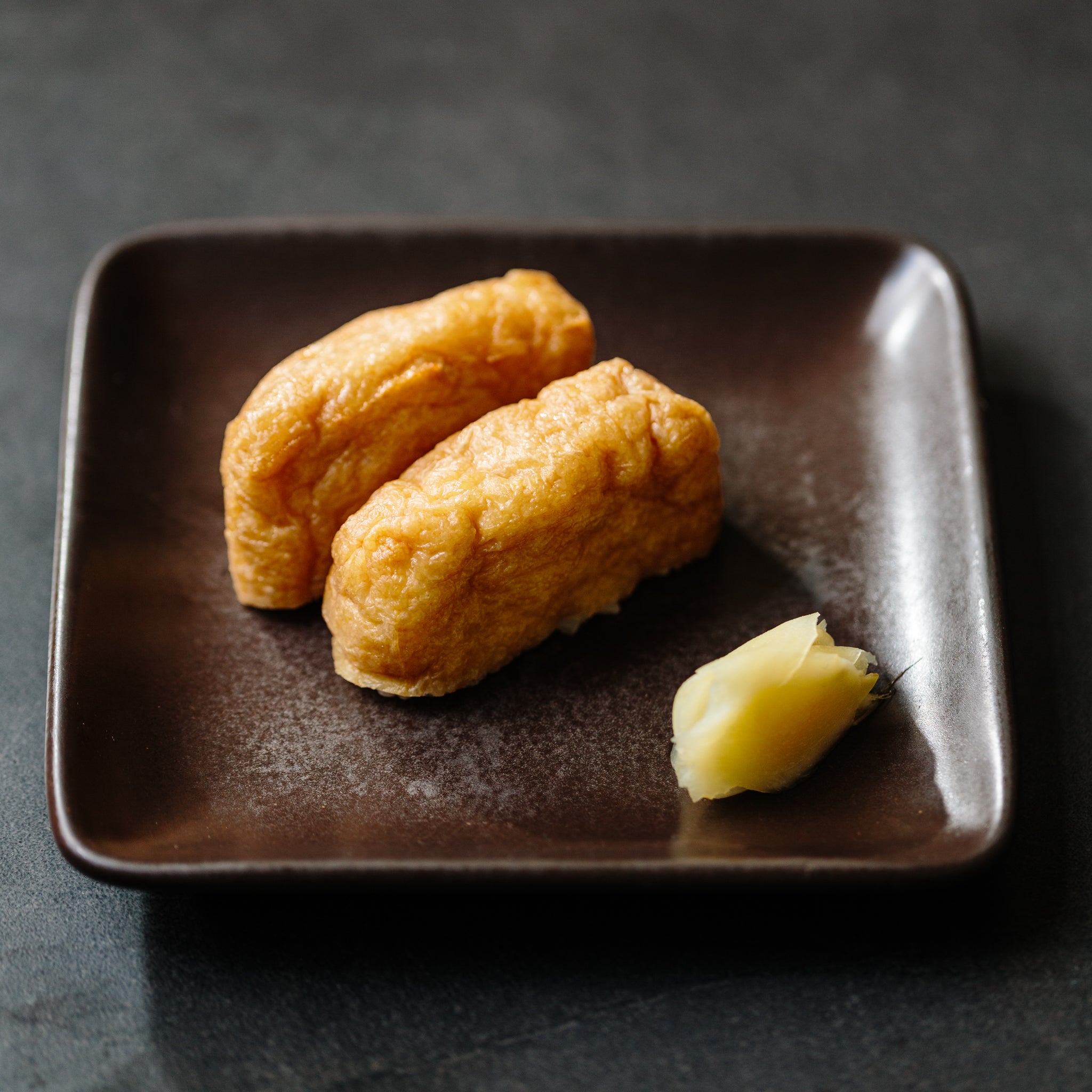Inari sushi — sweet seasoned aburaage tofu pouches filled with sushi rice