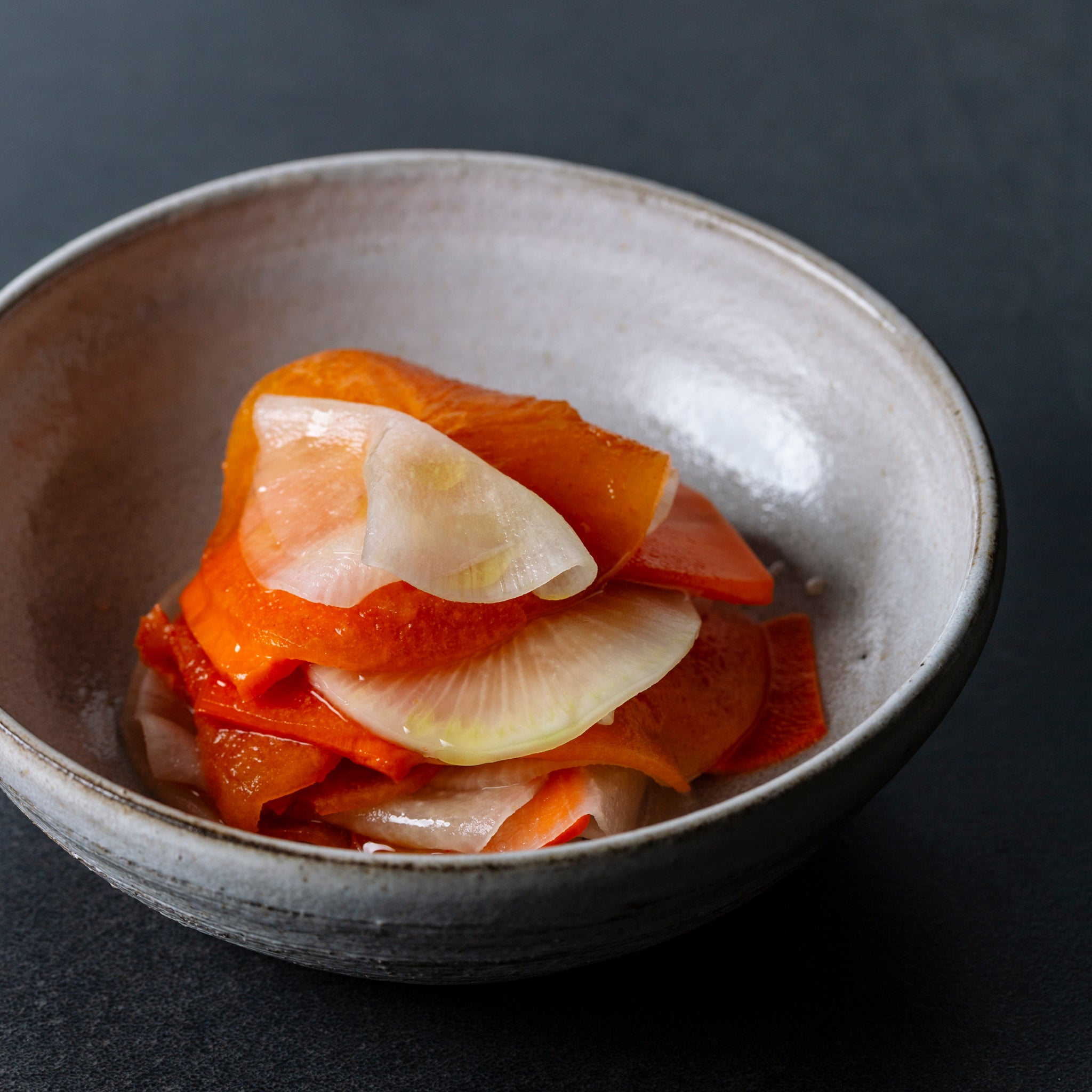 Fuyu persimmon, daikon, and carrot salad with Japanese rice vinegar and sesame oil dressing