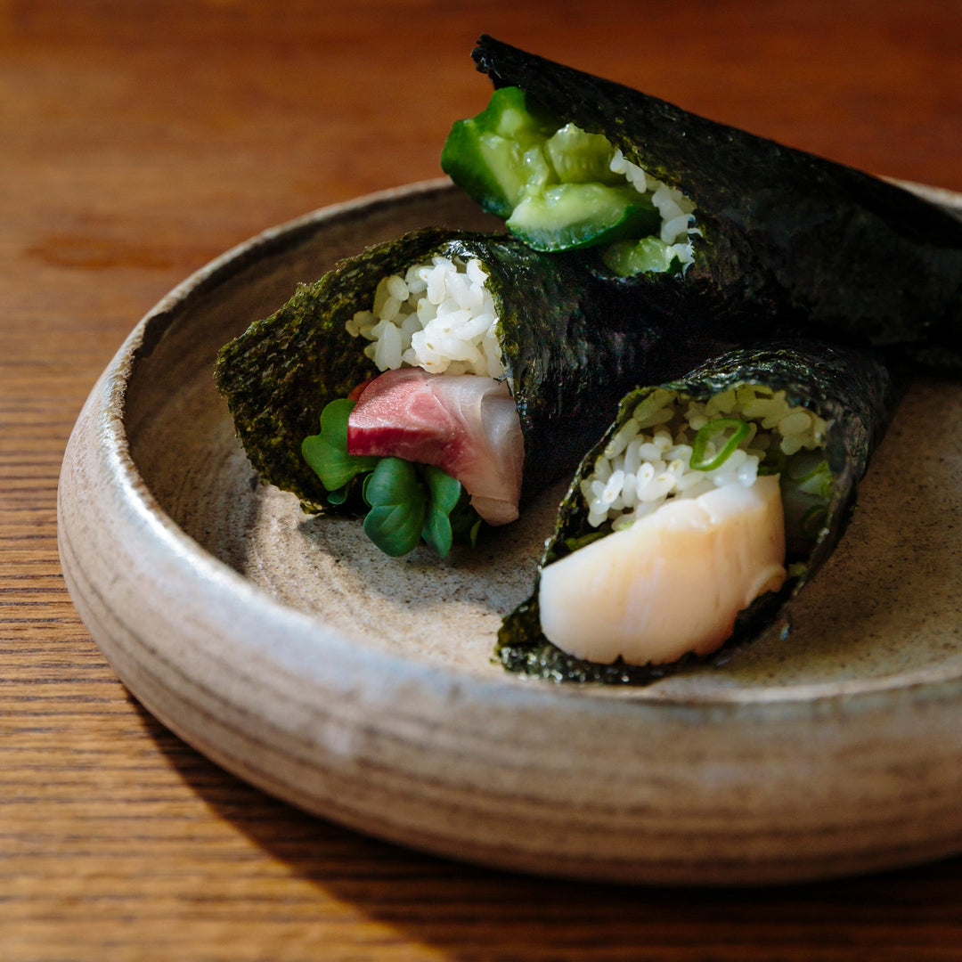 Temaki sushi — Japanese hand roll sushi with nori and fresh fillings