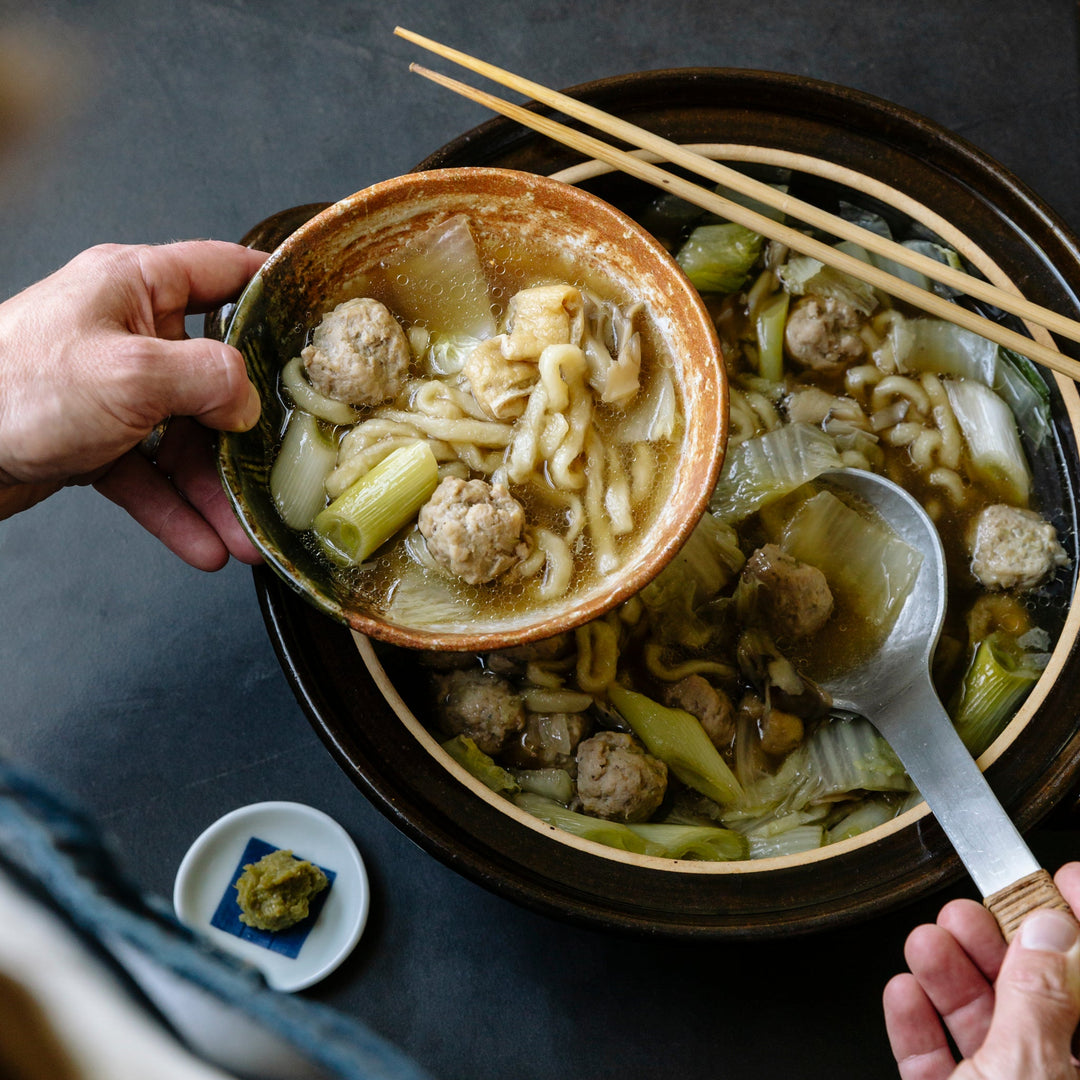 Tsukune and udon nabe — Japanese hot pot with chicken meatballs, udon noodles, and yuzu kosho