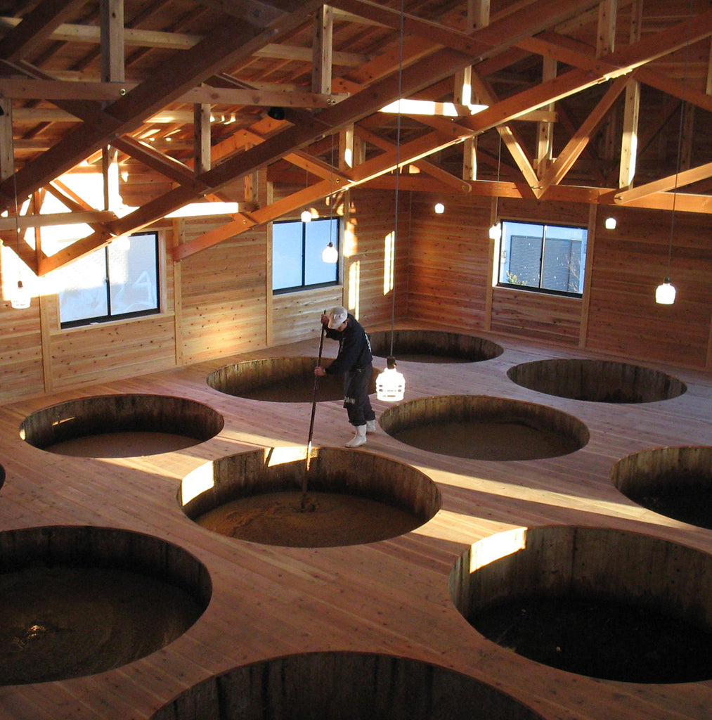 Cedar aging barrels in the aging room at Yugeta Shoyu brewery, Saitama Prefecture