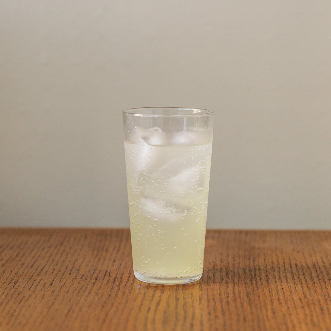 Yuzu vinegar shrub in cooler glass with ice