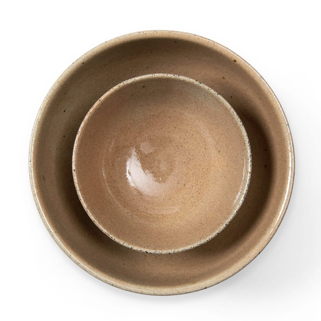 Two ceramic bowls stacked on a white background