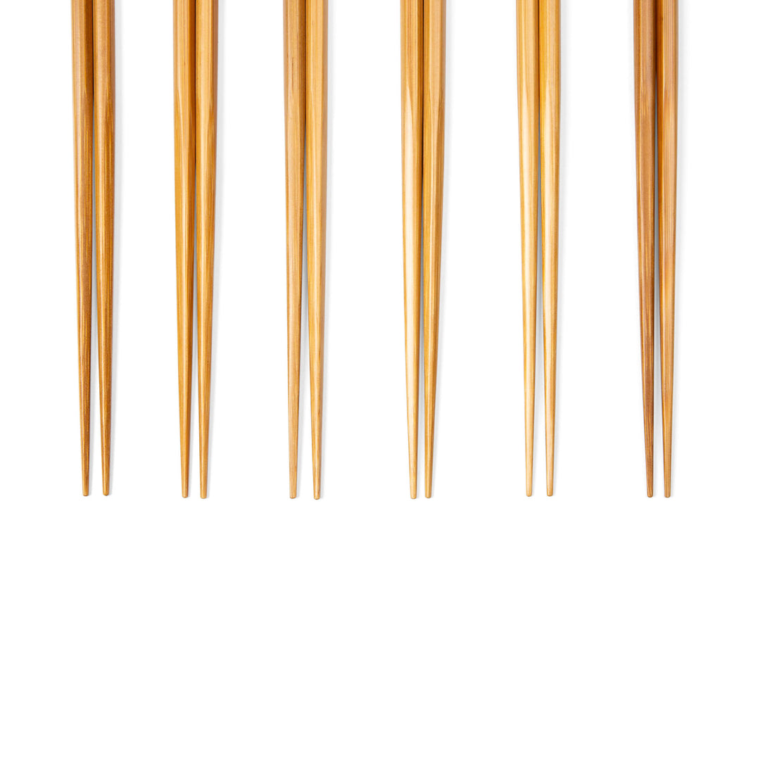 Set of bamboo chopsticks on a white background