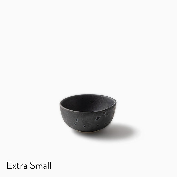 A small extra-small dark charcoal gray ceramic bowl with a speckled texture, shown on a clean white background with the text 'Extra Small' in the bottom-left corner.