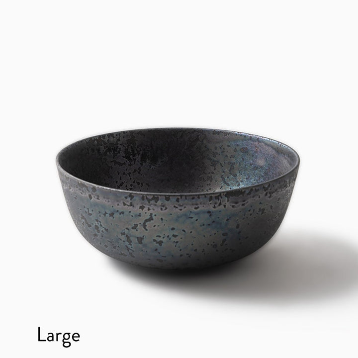 A large ceramic bowl with a textured, speckled glaze in dark charcoal gray and blue tones, shown on a white background with the word 'Large' printed in the bottom-left corner.