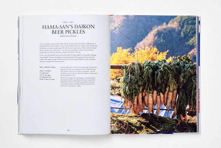 Open book showing an image of daikon against a mountainous background.