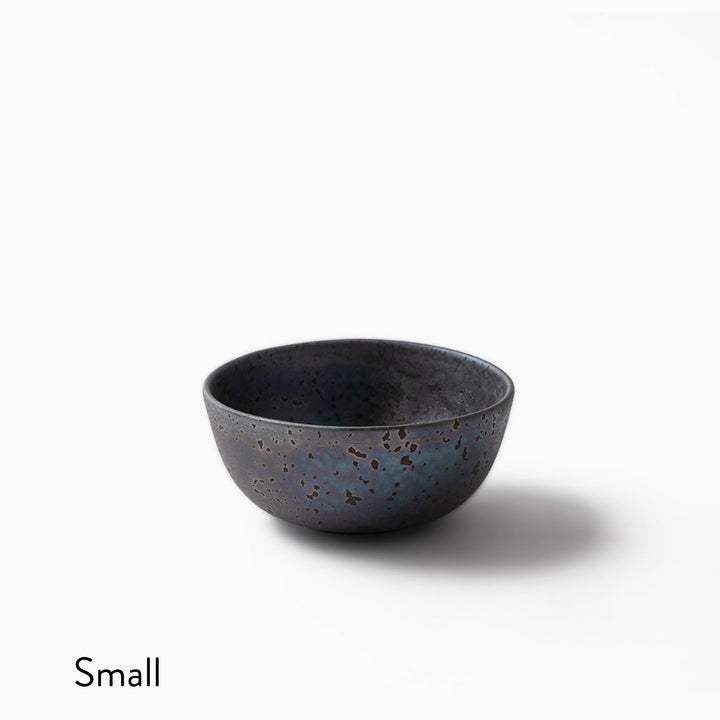 A small ceramic bowl with a speckled dark blue and black glaze, shown on a clean white background with the word 'Small' in the bottom-left corner.