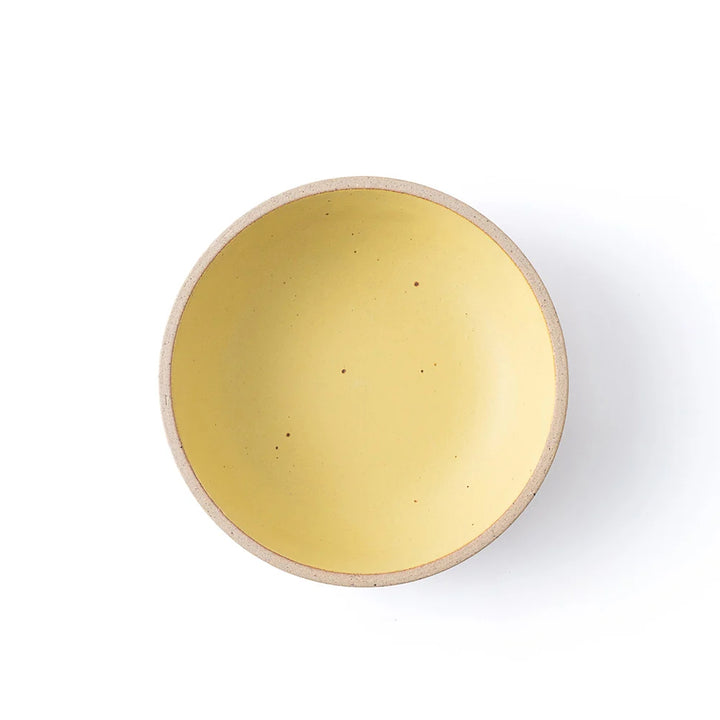 Round yellow object on a white background