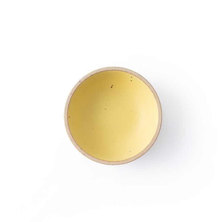 Round yellow object on a white background