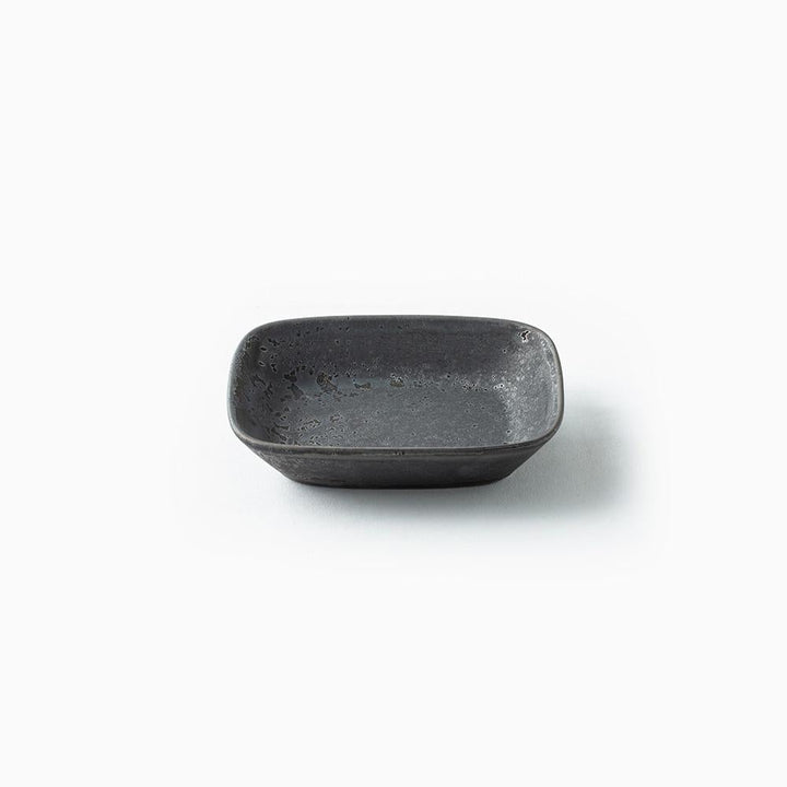 Small black ceramic bowl on a white background