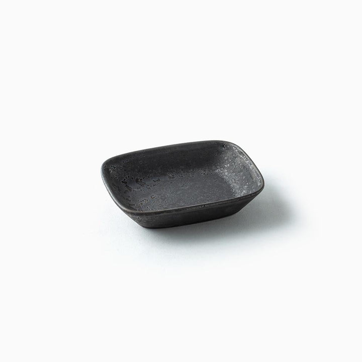 Small black ceramic bowl on a white background
