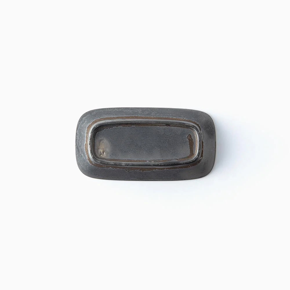 Bottom of dark gray ceramic bowl on a white background