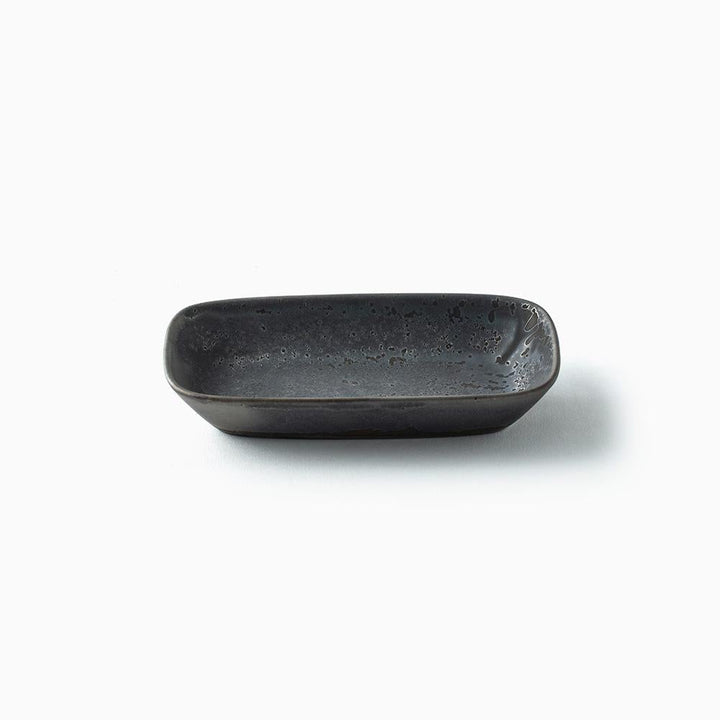 A dark charcoal gray rectangular ceramic dish with rounded corners and a textured, speckled glaze, shown on a clean white background with a soft shadow.