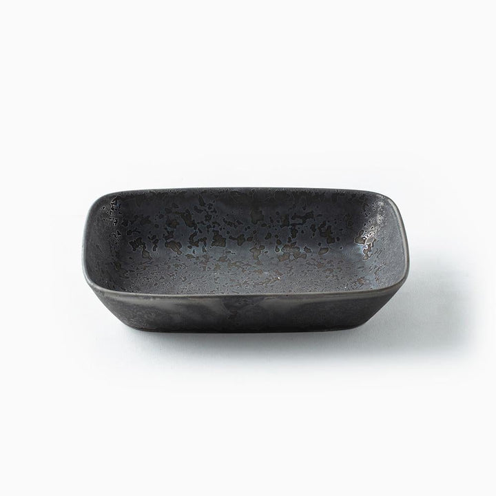 Black mottled rectangular ceramic bowl on a white background