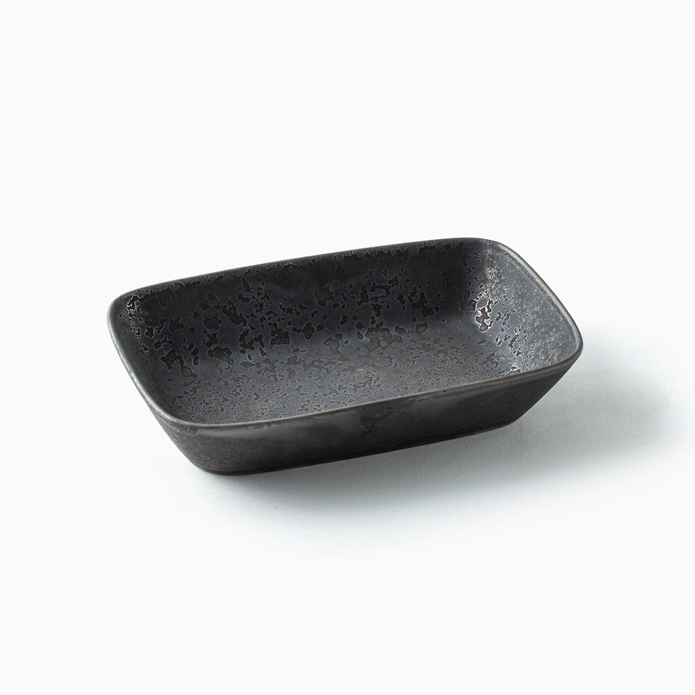 Black mottled rectangular ceramic bowl on a white background